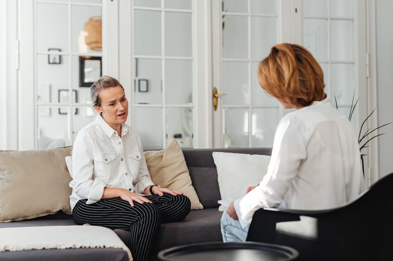 Private specialist consultation reviewing comprehensive physical health results connected to mental health symptoms at First Health Check