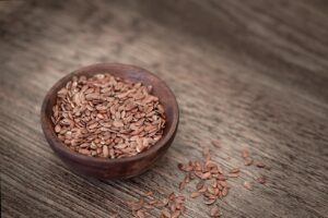 A picture of high fiber flax seeds in a bowl. Fibermaxxing