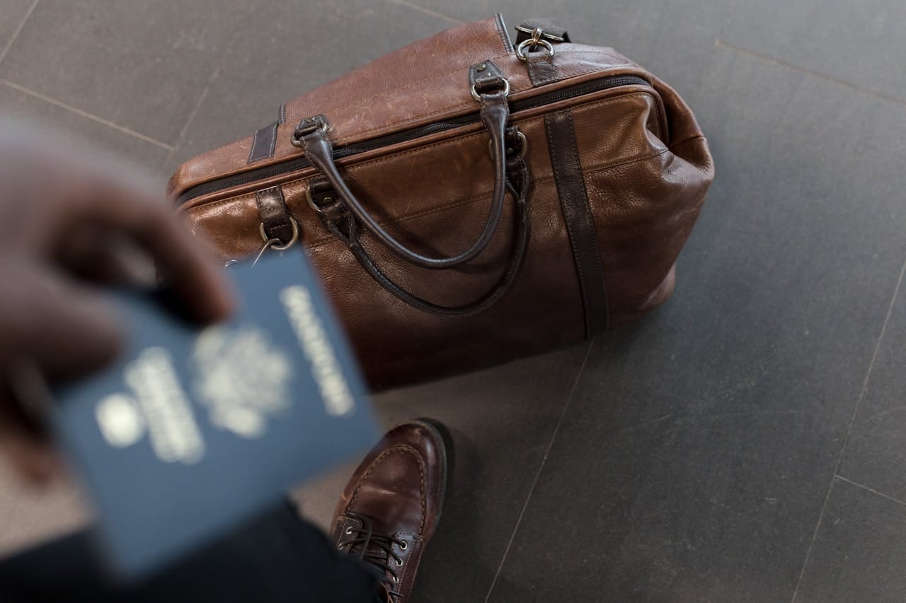 Private Health Assessment. Medical Tourism, travel bag with passport