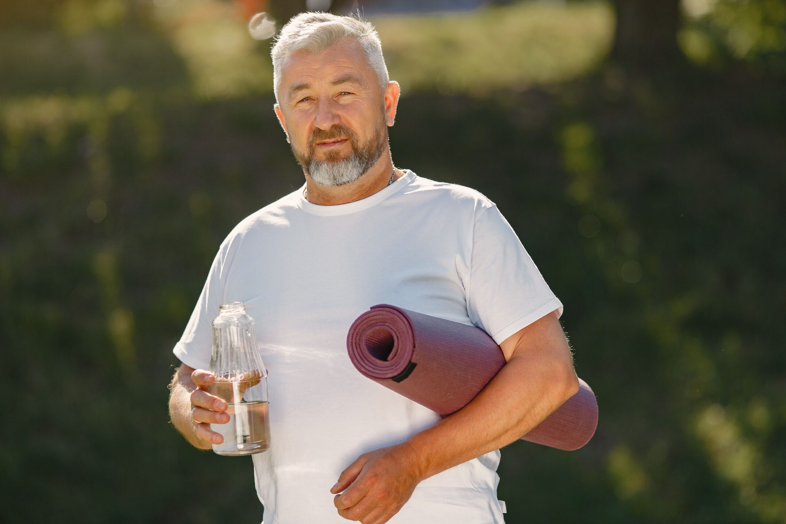 men's health screening - man lifting weights taking control of his health
