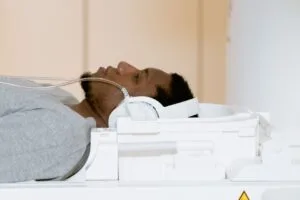 A patient is lying inside a CT scanner for a medical examination.