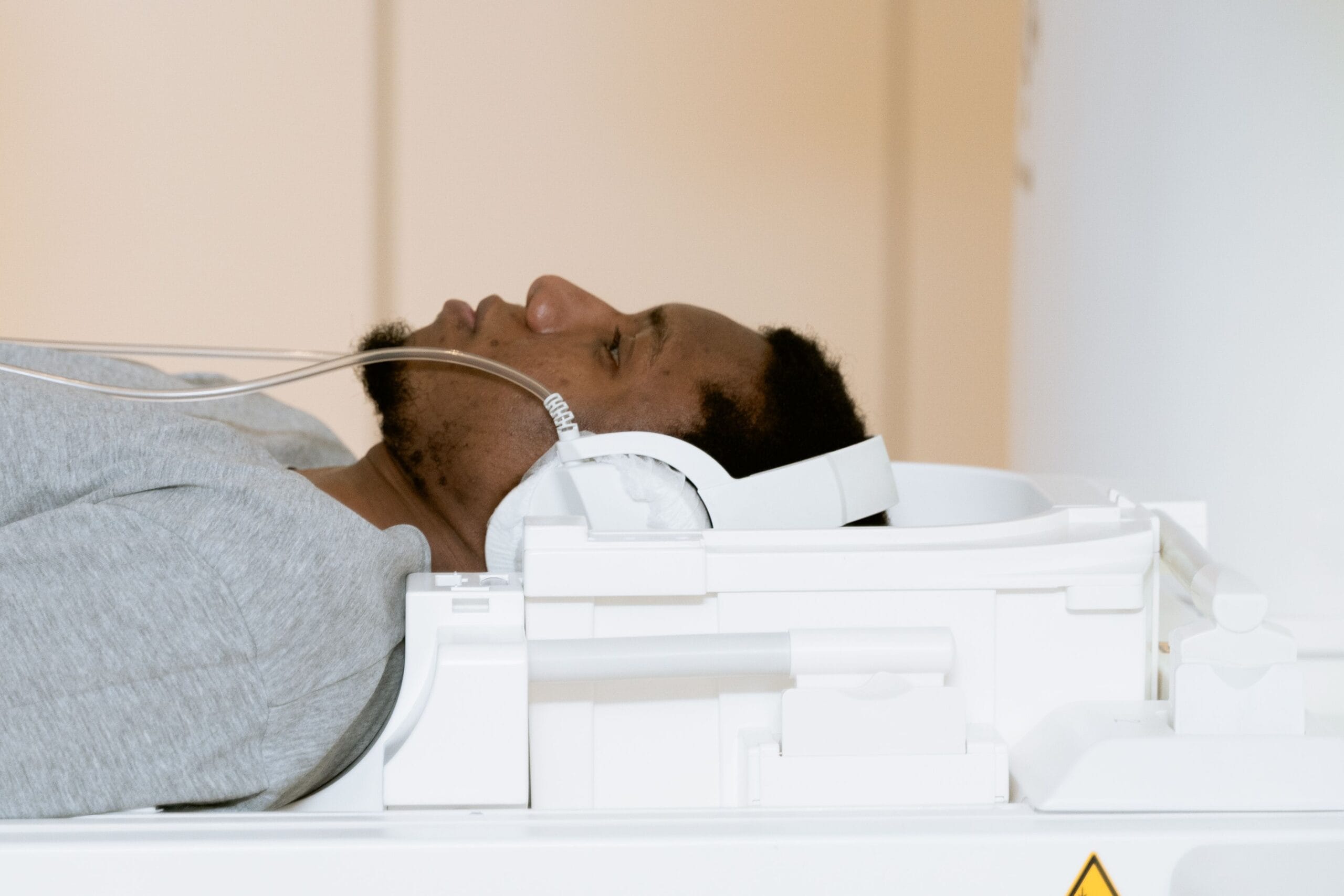 A patient is lying inside a CT scanner for a medical examination.