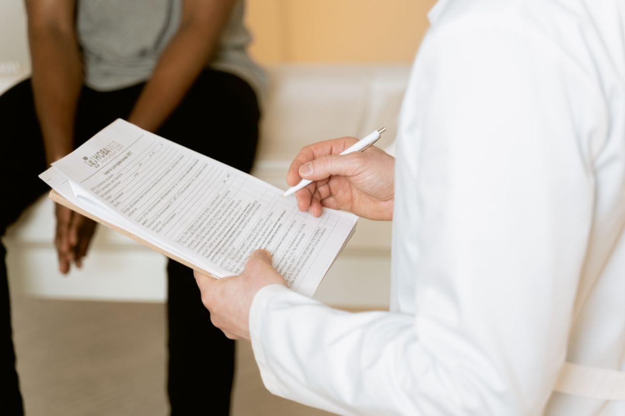 Client completing a medical questionnaire before travelling